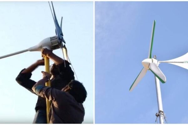 Dos personas instalando un generador eólico doméstico en un tejado.