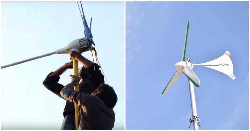 dos personas instalando un generador eólico doméstico.